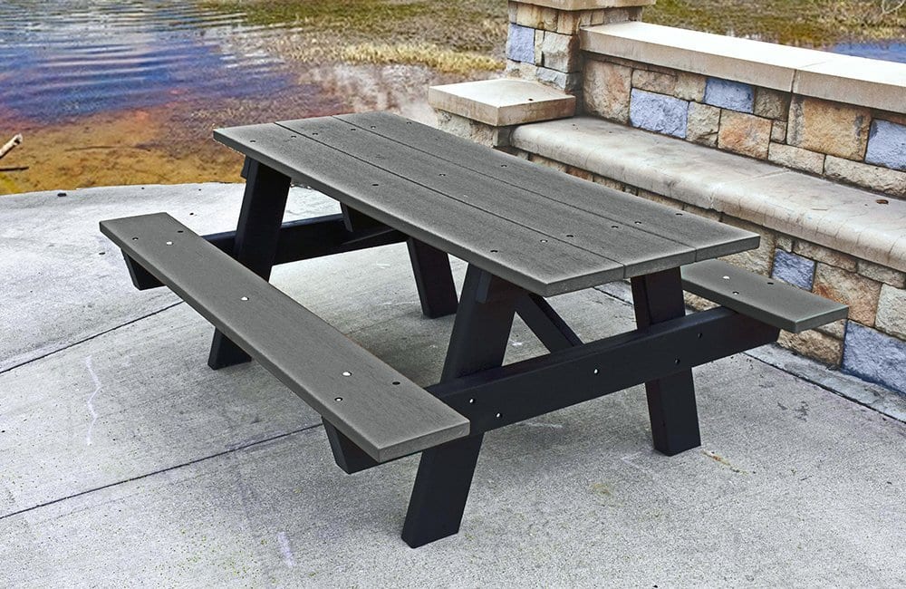 Outdoor picnic table by a lake.