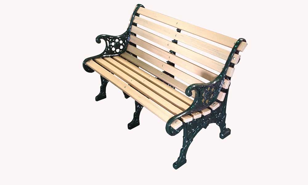Wooden bench with ornate metal armrests and legs.
