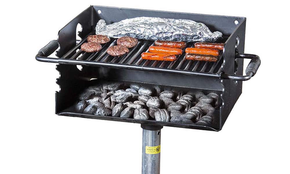 Portable grill with charcoal and food cooking.