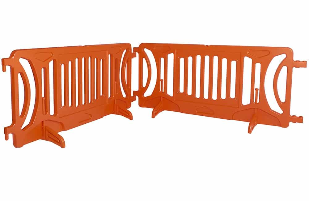 Orange plastic barrier fence segments.