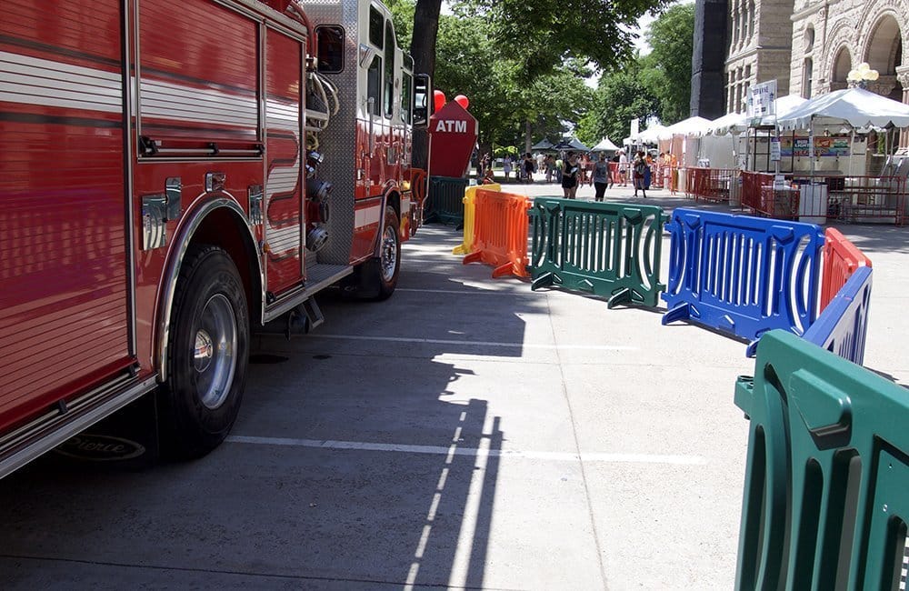 Red fire truck parked on a city street.