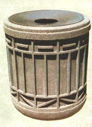Concrete trash can with a circular opening at the top.