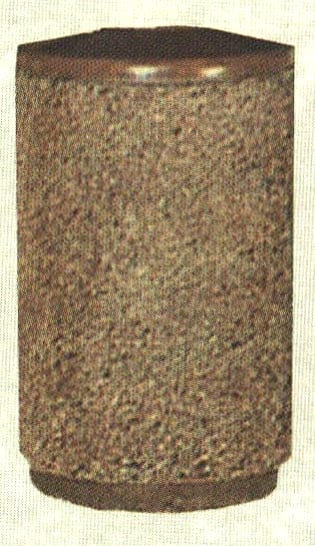 Brown cylindrical object with textured surface.