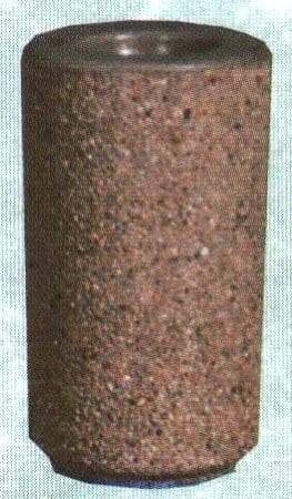 A cylindrical object with a rough, textured surface.