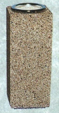 A textured cylindrical object with a metallic top.