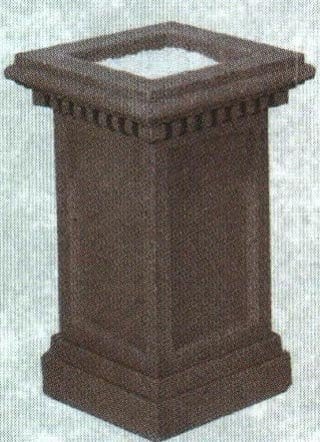 Brown stone pedestal with decorative detailing.
