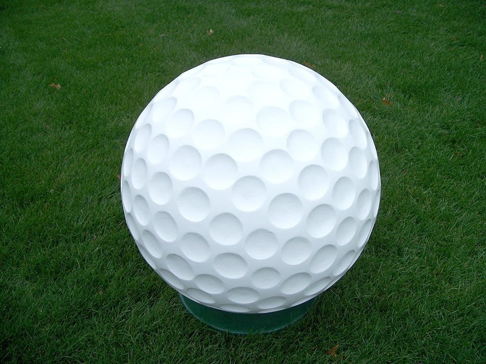 Golf ball on green grass.