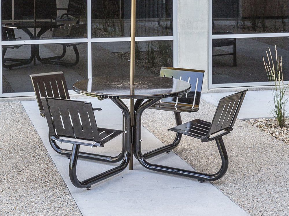 Outdoor patio table and chairs with umbrella.