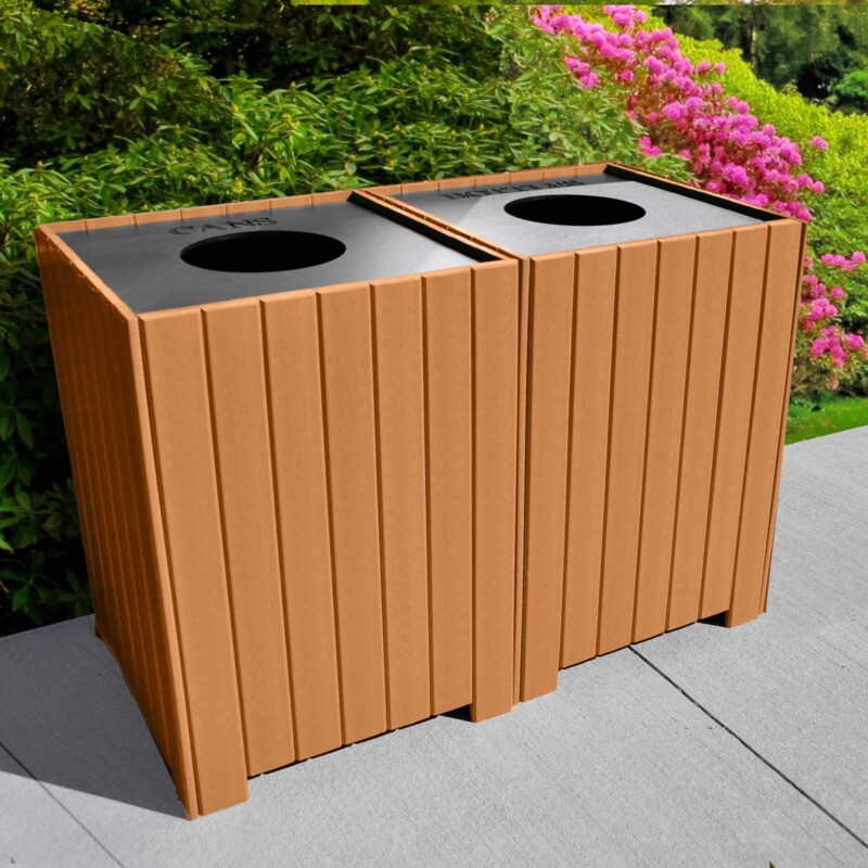 Recycling bin with wooden panels and pink flowers in background.