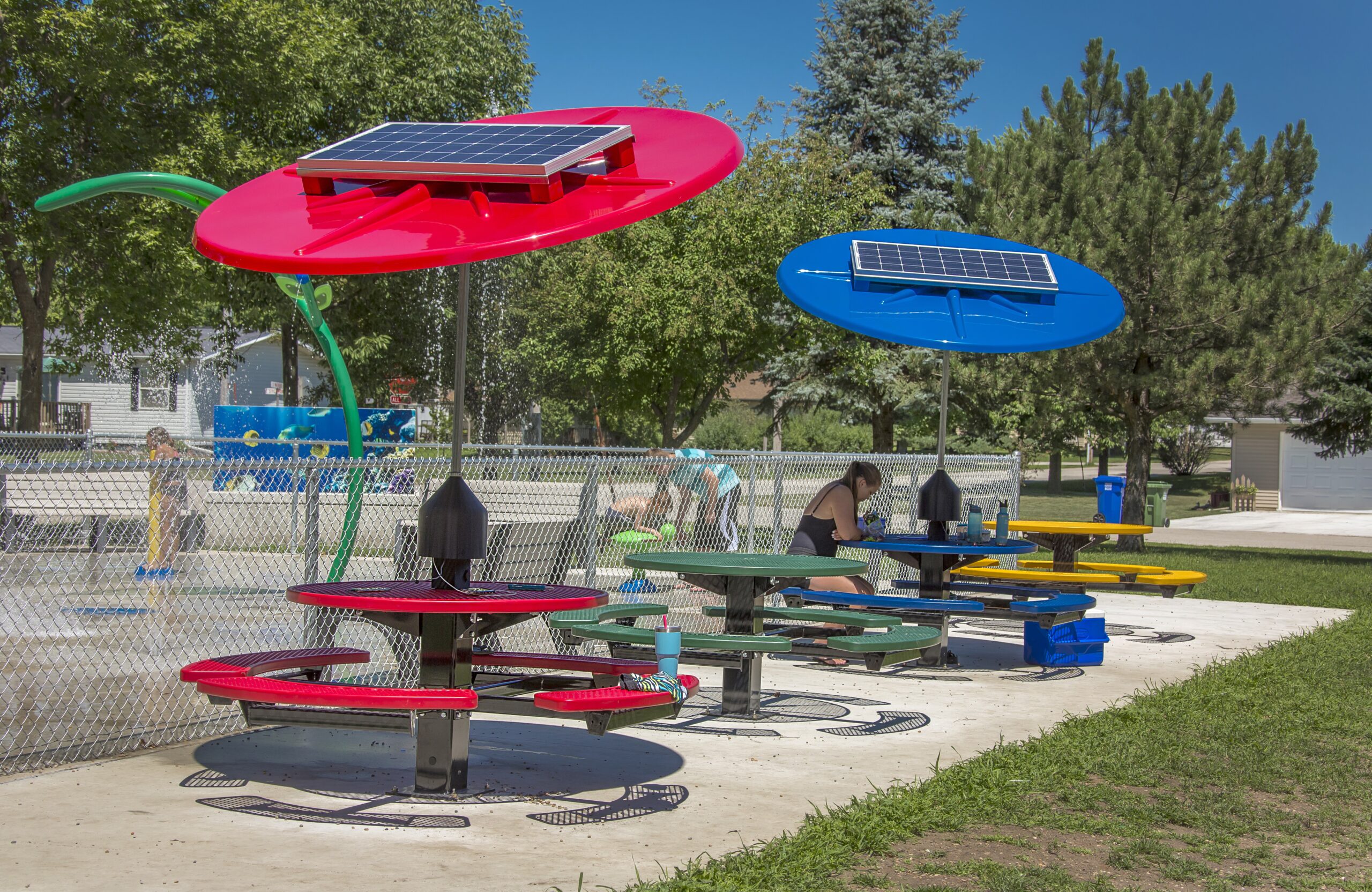Solar-powered picnic tables in a park.