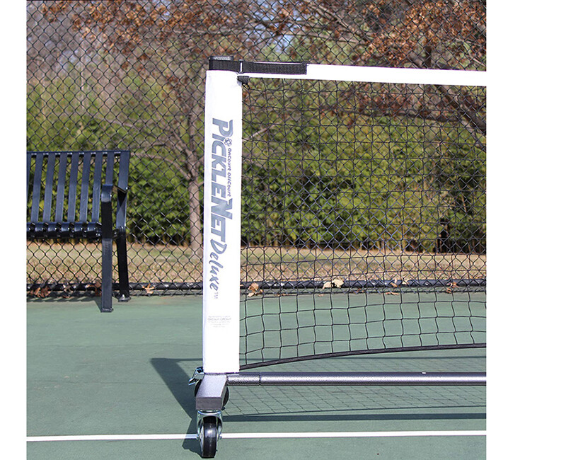 Pickleball net on a tennis court.