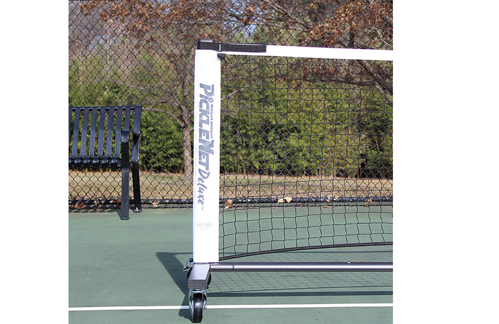 Pickleball net on a tennis court.