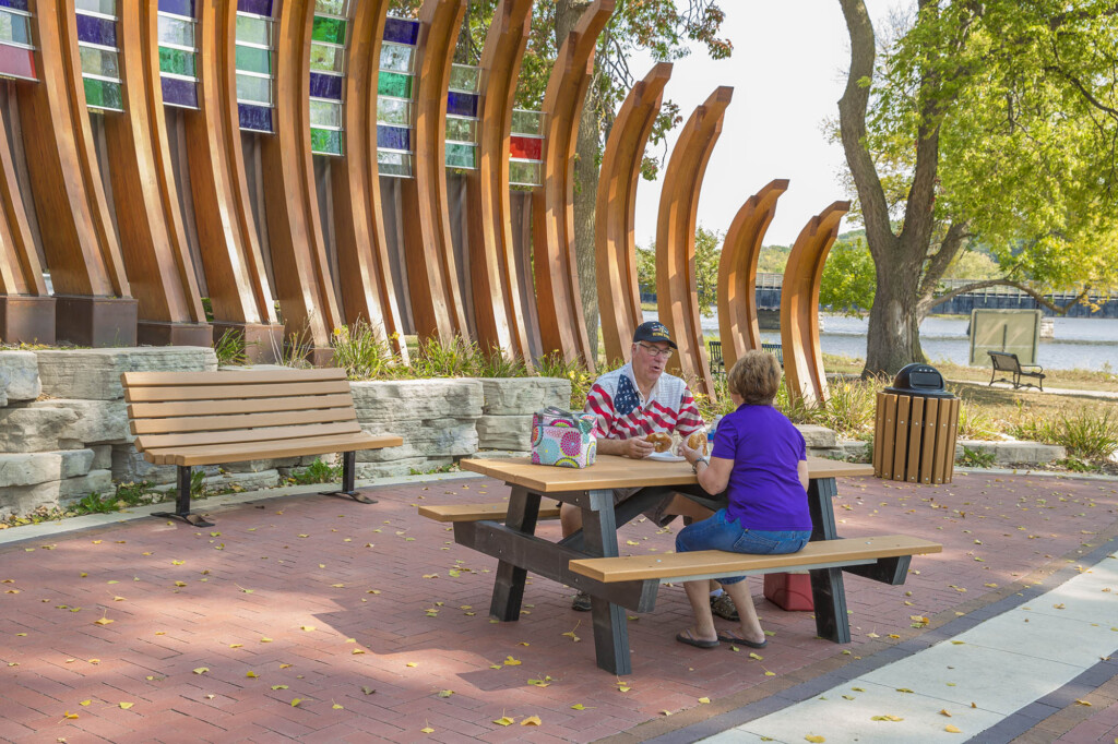 People enjoying a picnic at a modern outdoor park.