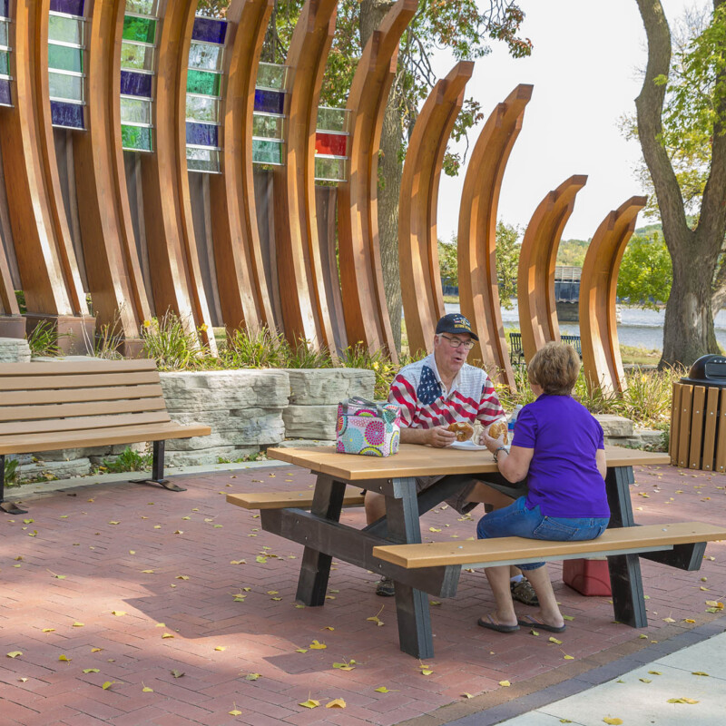 People enjoying a picnic at a modern outdoor park.