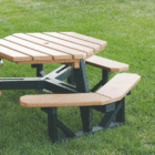 Octagonal picnic table on grass.