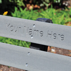 Bench with engraved placeholder: Your Name Here.