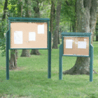 Outdoor bulletin boards in a park setting.